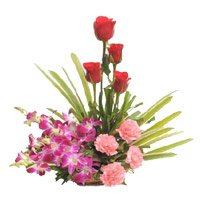 Send Rakhi with Flowers to Delhi. Online Orchids, Roses, Carnation Basket of 12 Flowers to Delhi