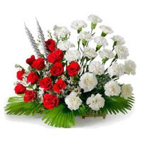 Send Red and White Carnation Basket of 24 Rakhi Flowers in Delhi