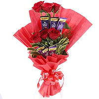 Place order to send 16 Pcs Ferrero Rocher and 24 Red White Roses Bouquet Delhi