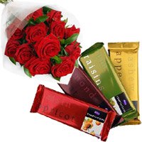 Online Gift of 4 Cadbury Temptation Bars with 12 Red Roses Bunch and Rakhi Flowers to Delhi