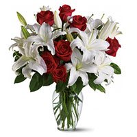 Place Order for Rakhi Flowers to Delhi. 4 White Lily 12 Red Roses to Delhi in Vase