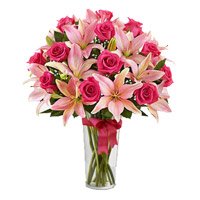 Order Online Flower Delivery in Delhi. 4 Pink Lily 15 Pink Rose in Vase on Rakhi