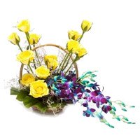 Send 6 Orchids and 12 Roses Arrangement of Rakhi Flowers to Delhi