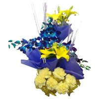 Fresh Flower Delivery in Delhi. 4 Yellow Lily 4 Blue Orchids 6 Yellow Carnation Basket on Rakhi